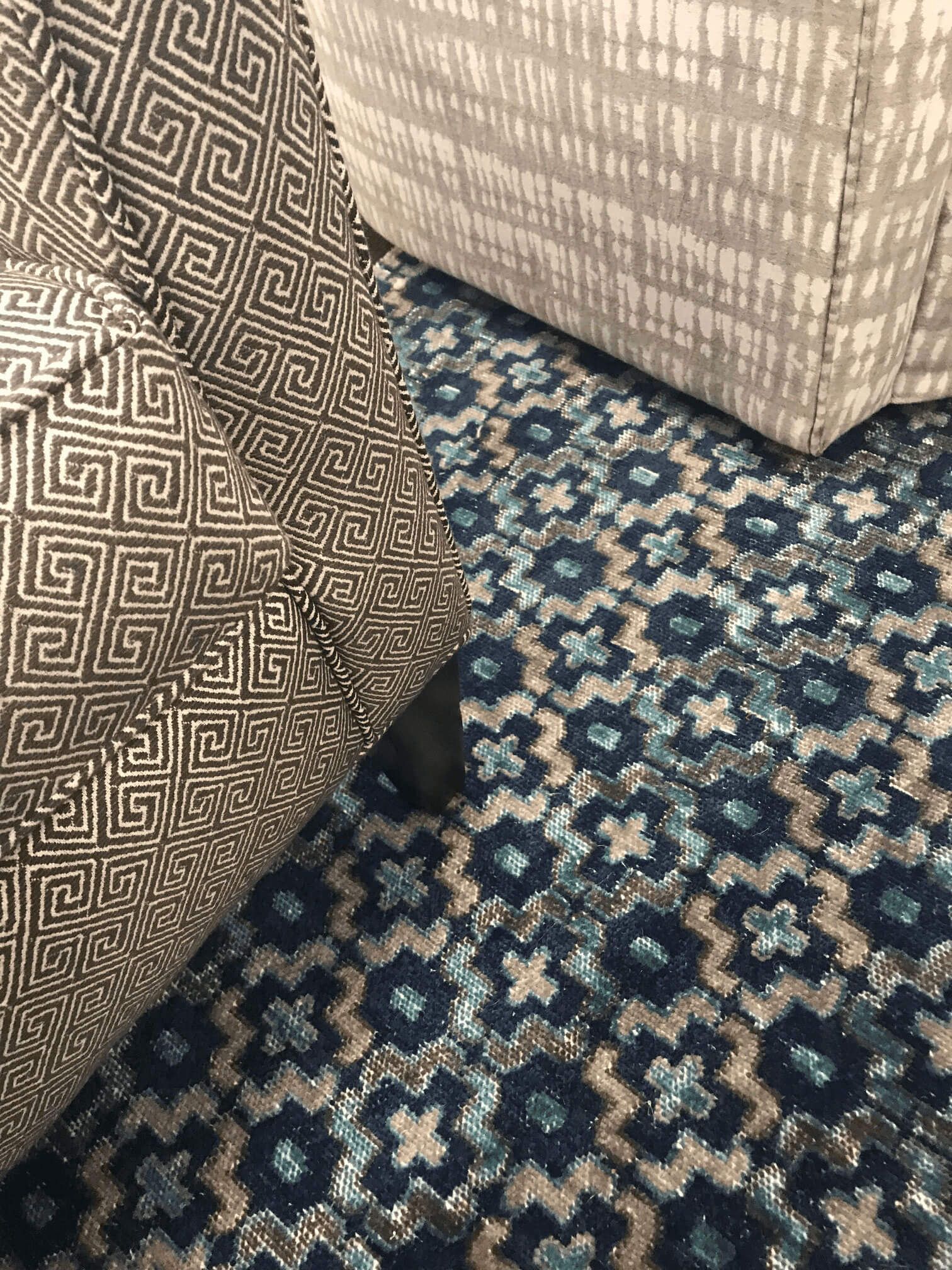 Living room chairs on a rug by Manhattan Textiles - Interior Designer in Milwaukee, WI